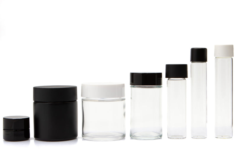 Three clear glass jars with white labels and black and silver lids